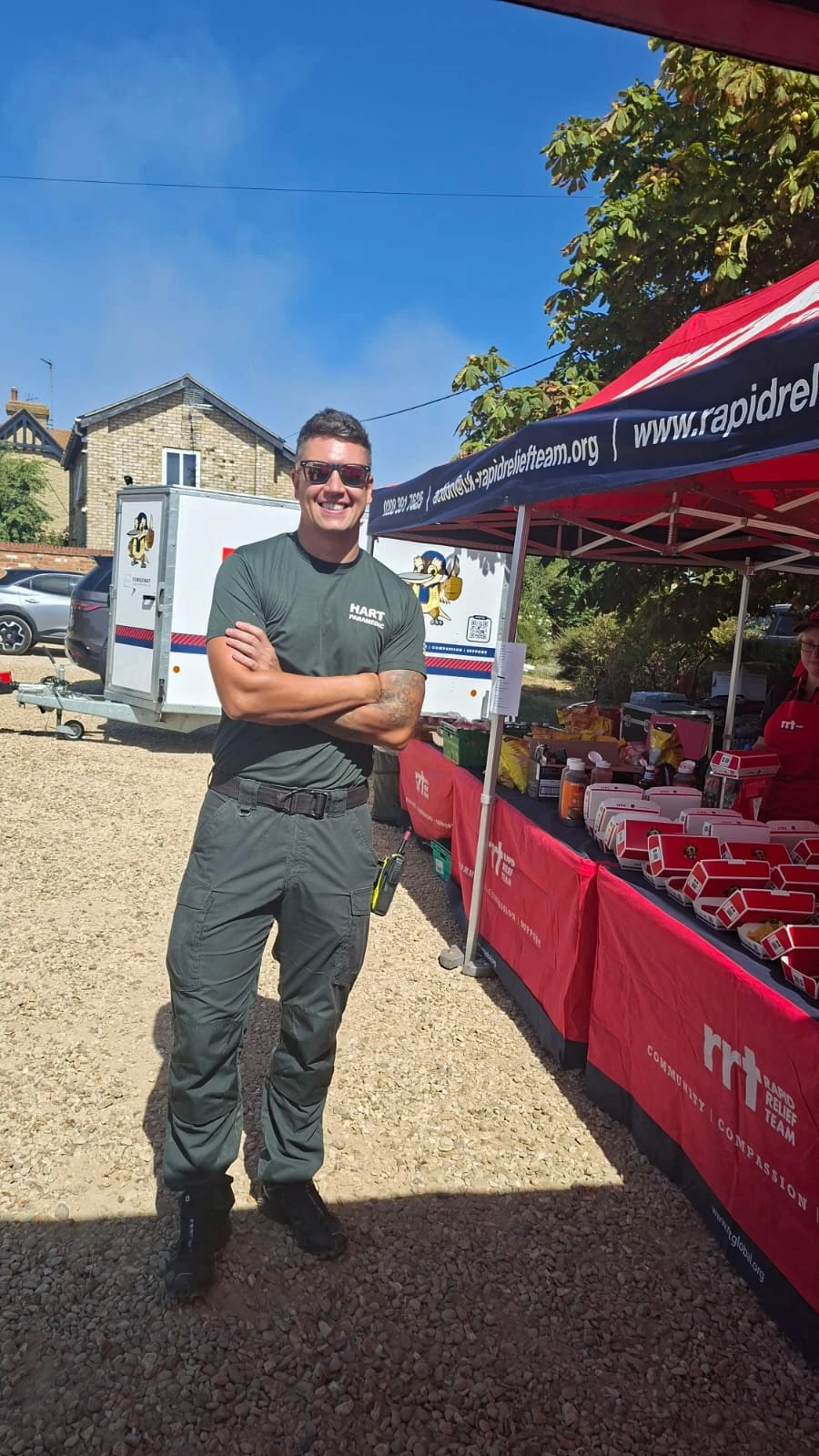 A Hazardous Area Response Team paramedic standing beside the Rapid Relief Team catering gazebo at Holme